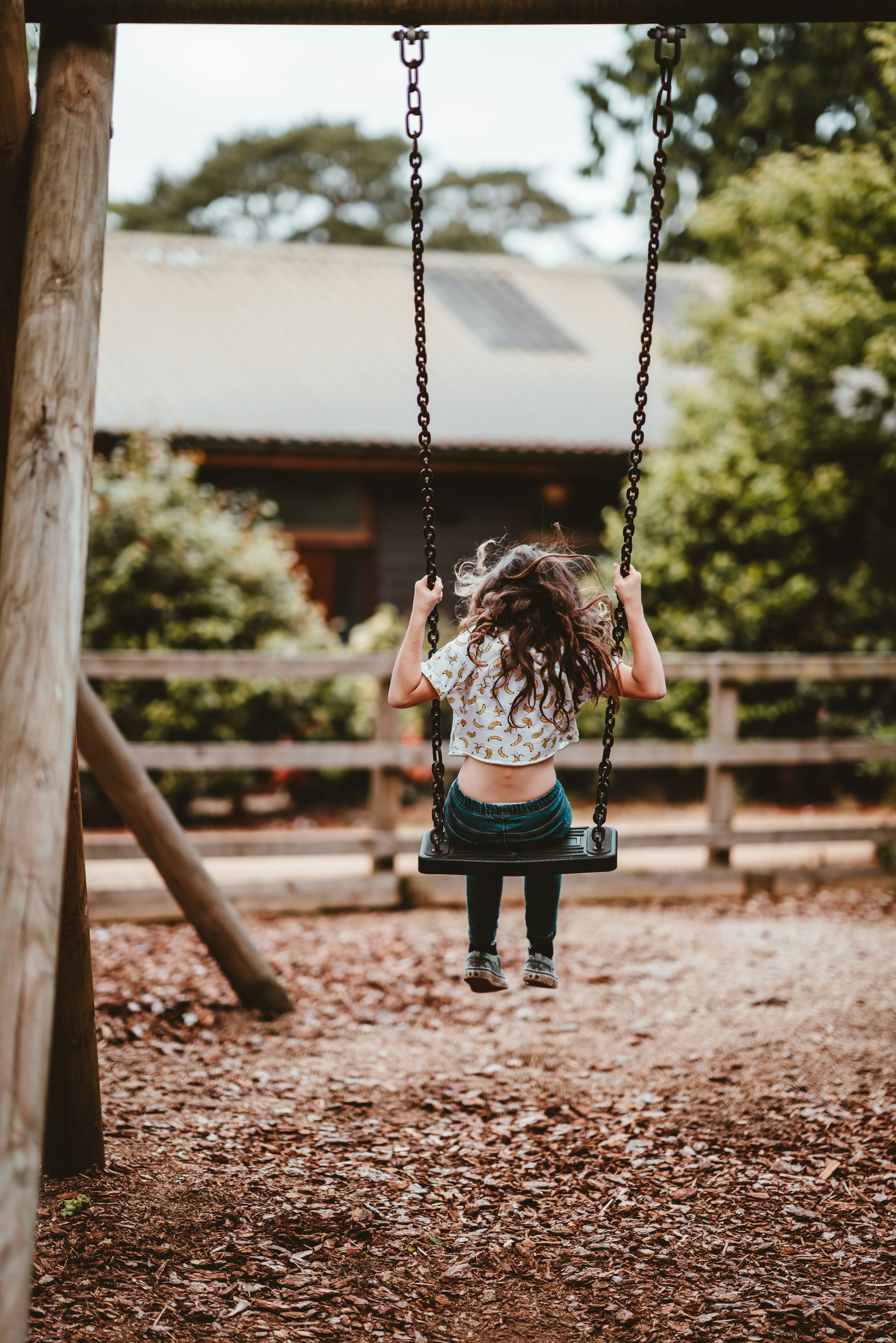 Young girl on a swing